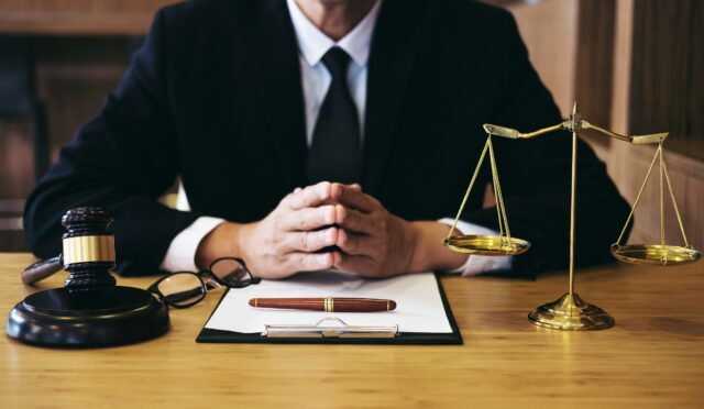 Judge gavel with Justice lawyers, Businessman in suit or lawyer working on a documents. Legal law, advice and justice concept